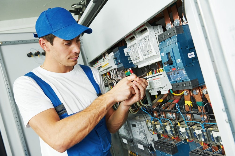 Young,Adult,Electrician,Builder,Engineer,Screwing,Equipment,In,Fuse,Box